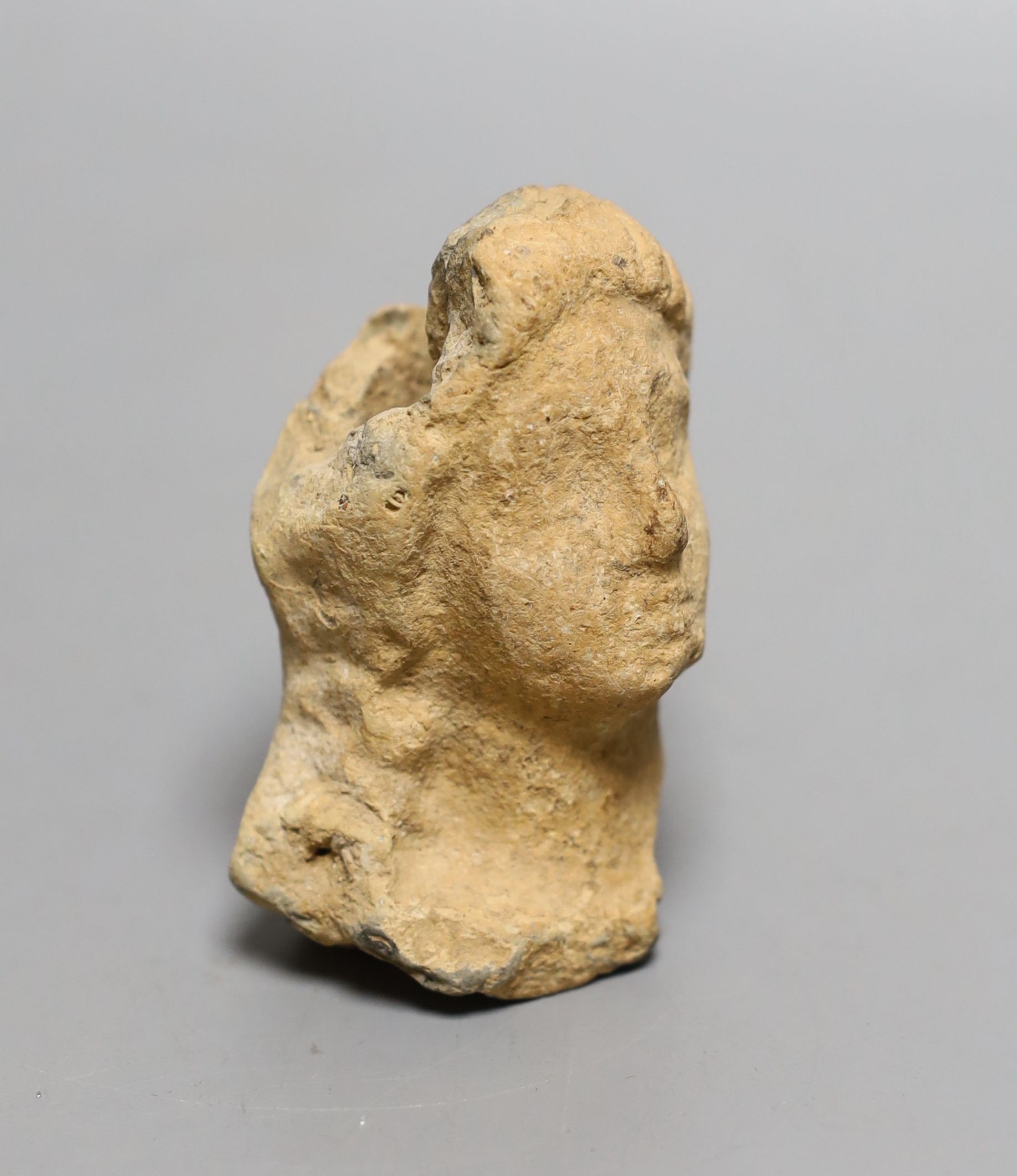 An antiquity terracotta figure head, 8cms high.